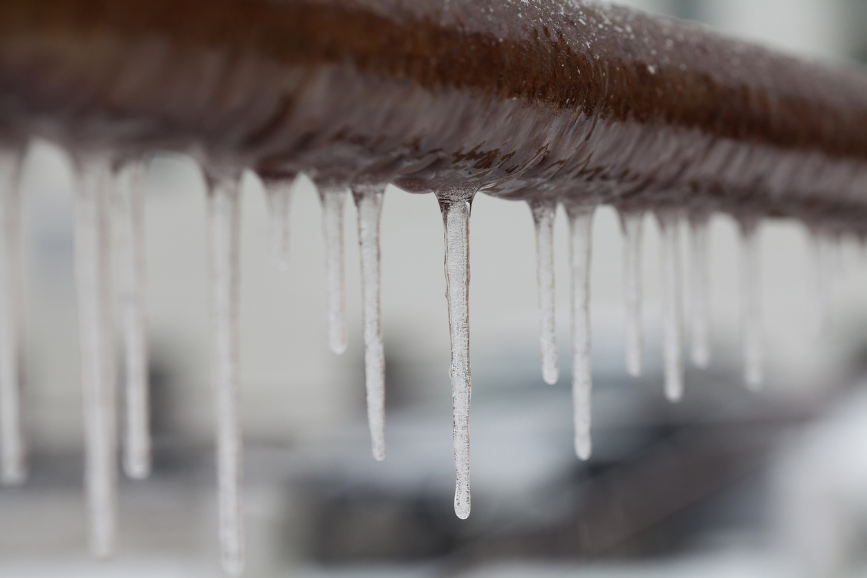 Icicles hanging from a pipe